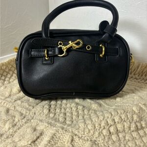 Elegant Black Handbag with Gold Accents